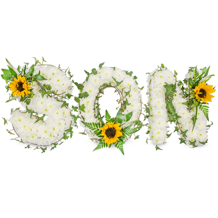 A bespoke memorial display clearly spells SON in capital letters, crafted as a three-dimensional floral tribute and photographed against a pure white background to preserve every delicate detail. Each letter is densely constructed from hundreds of small, snowy-white chrysanthemums, their tight, rounded petals creating a soft, pillowy texture that reads as comfort and calm. Interlaced through the white floral canvas are strands of deep green ivy whose trailing tendrils add sculptural lines and a sense of perpetual life, accompanied by feathery fern fronds and assorted leafy sprigs that introduce varying greens and a subtle play of shadow.
Three radiant sunflowers punctuate the composition: one is nestled into the upper-left curve of the S, another rests at the lower centre of the O amid the ferns, and the third is positioned on the upper-right of the N. The sunflowers' broad, sunflower-yellow petals encircle pronounced dark-brown centres, giving tactile contrast to the chrysanthemum's softness and creating intentional focal points that guide the eye along the inscription. The colour palette-pure white, rich greens and warm yellow-speaks to reverence, life remembered, and the warmth of cherished memories.
Friendly to families in Merton, Wimbledon Village and nearby South Wimbledon, this arrangement sits well at memorial services, funeral chapels or as a commemorative display at a graveside near Morden Park. The studio's even lighting in the photograph reveals the arrangement's gentle scent profile-the chrysanthemum's light, almost tea-like aroma and the earthy, dry notes of sunflower heads-presenting a dignified and heartfelt tribute.